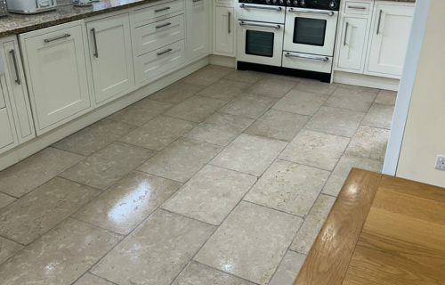 "Dirt Busters team polishing hard floors, ensuring a shiny finish with eco-friendly cleaning solutions."