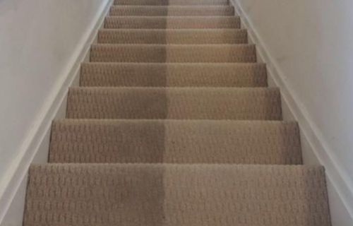 "Professional carpet cleaning in progress by Dirt Busters, showcasing deep-cleaning equipment on a stained carpet."