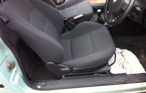  "Expert upholstery cleaning service by Dirt Busters, revitalizing a sofa with advanced cleaning tools."